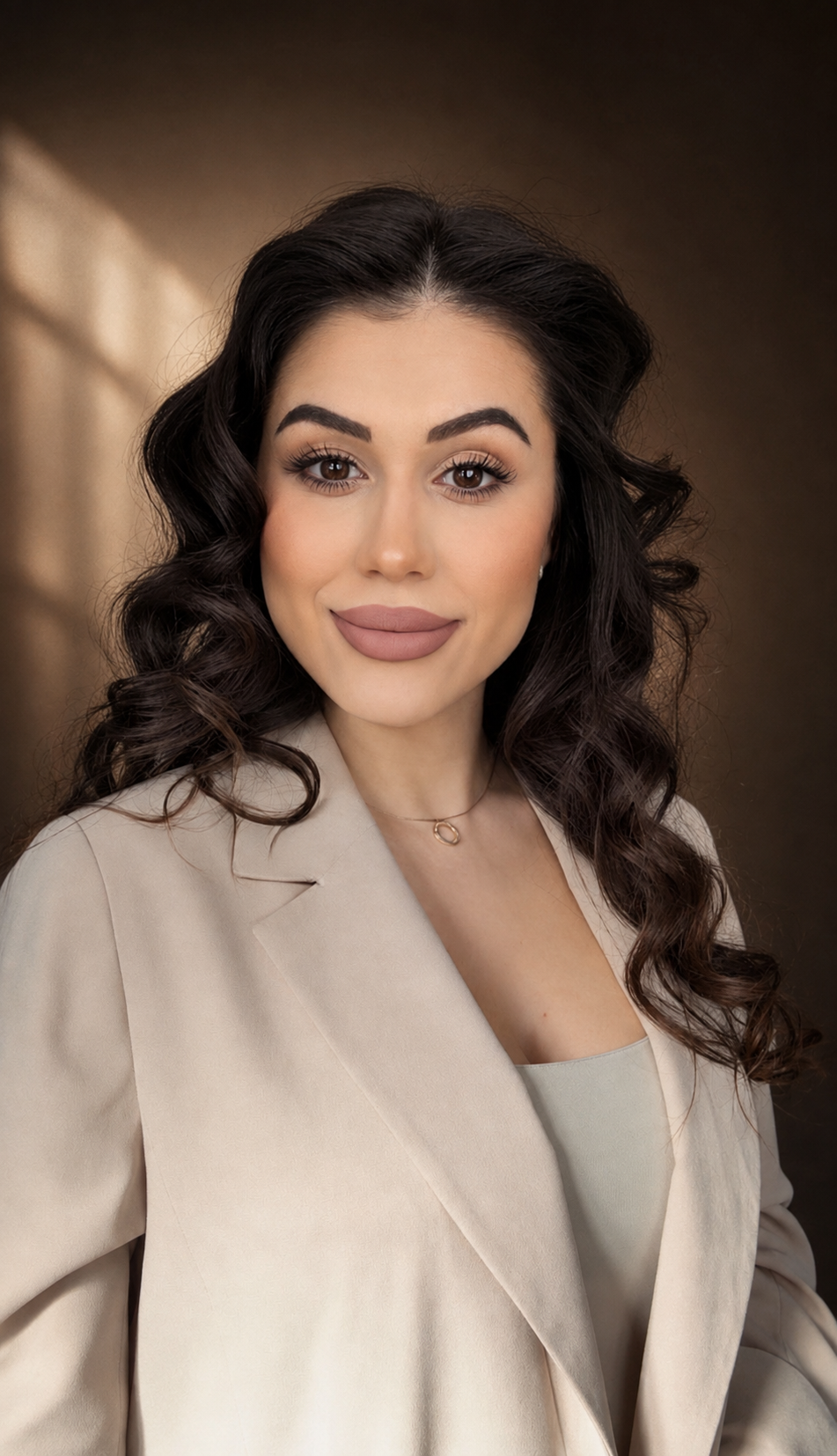The beauty artist behind The House of AURE in a cinematic studio portrait